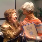 Margie with a seminar attendee