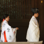 Traditional white kimonos in Japanese funeral