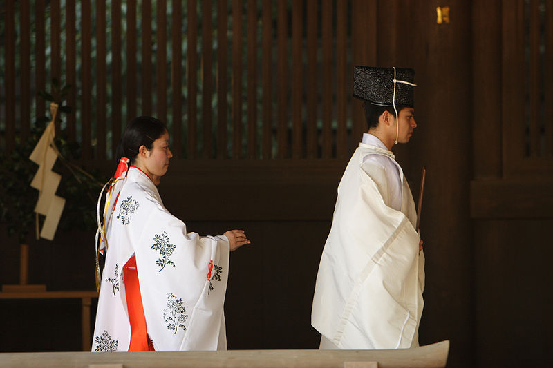 Traditional white kimonos in Japanese funeral