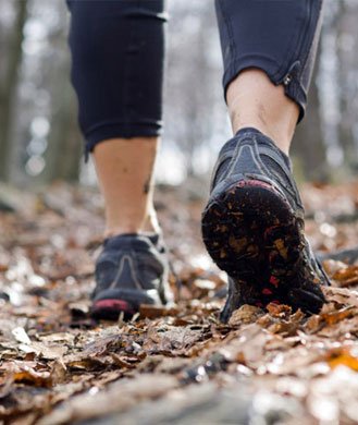 Feet of someone running to cope with grief