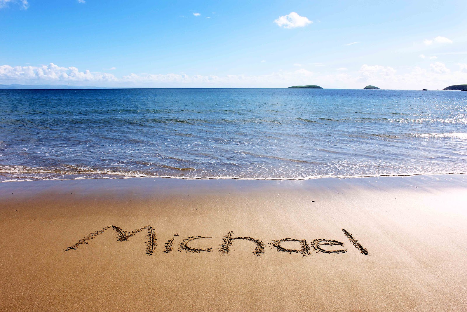 The name of a loved one written in the sand