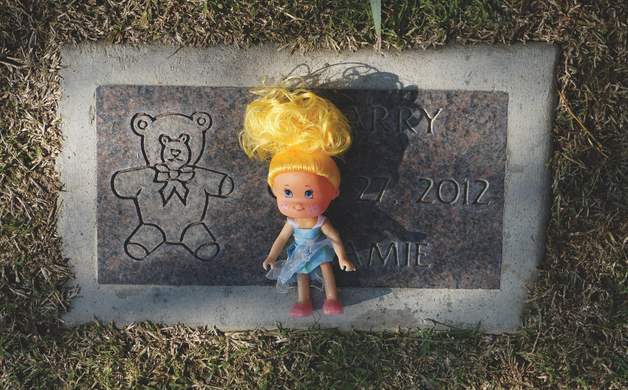 Headstone for one of many children who died and are buried by Garden of Innocence
