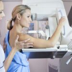 A woman getting a mammogram