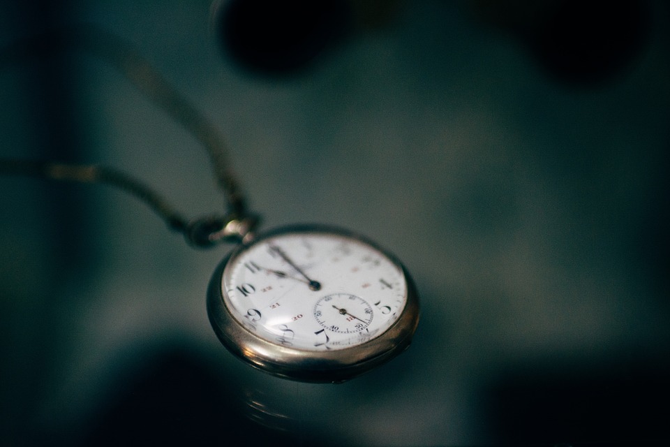 A wristwatch sitting on a table, representing the passing of time