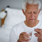 Man taking a pill to demonstrate placebo effect