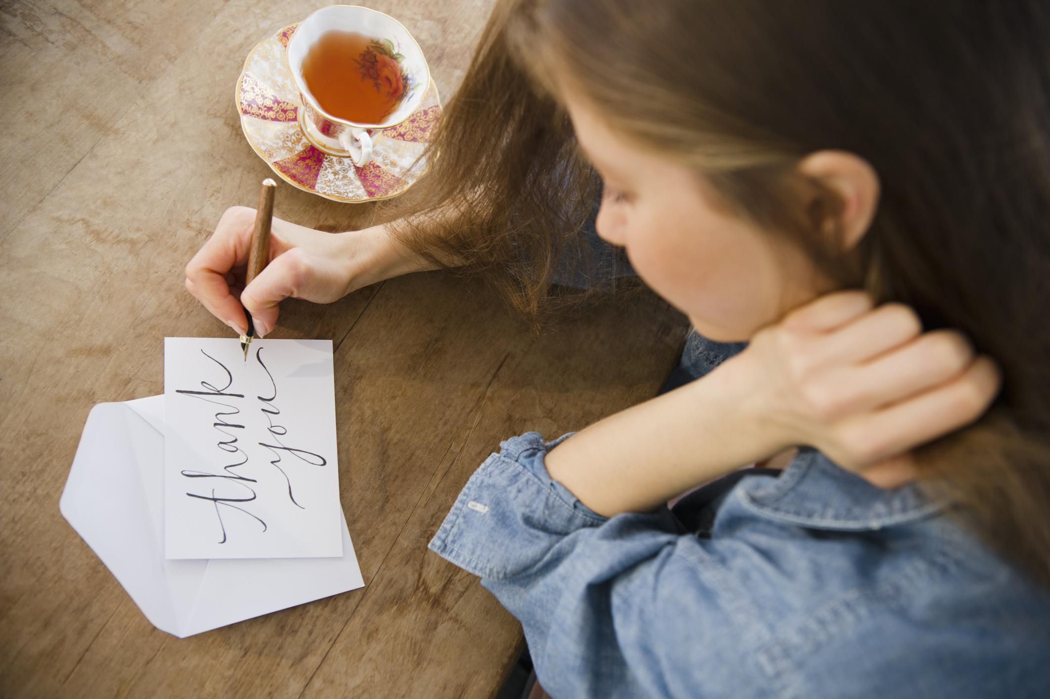 Woman writing thank you cards