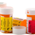 Pill bottles symbolizing expired medication.