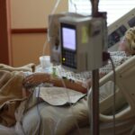 Woman in hospital bed with short life expectancy