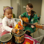 Music therapist works with cancer patient