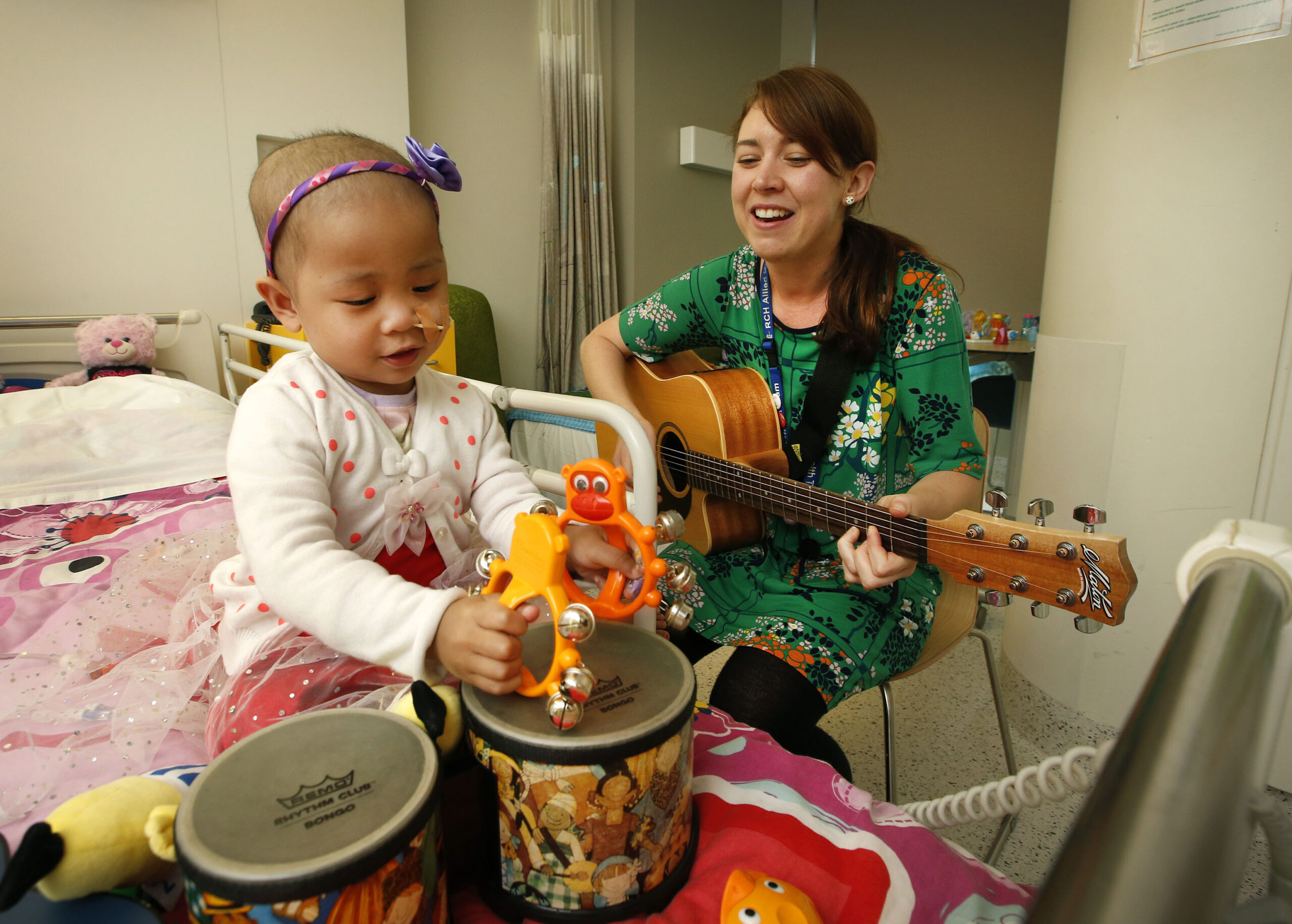 Music therapist works with cancer patient