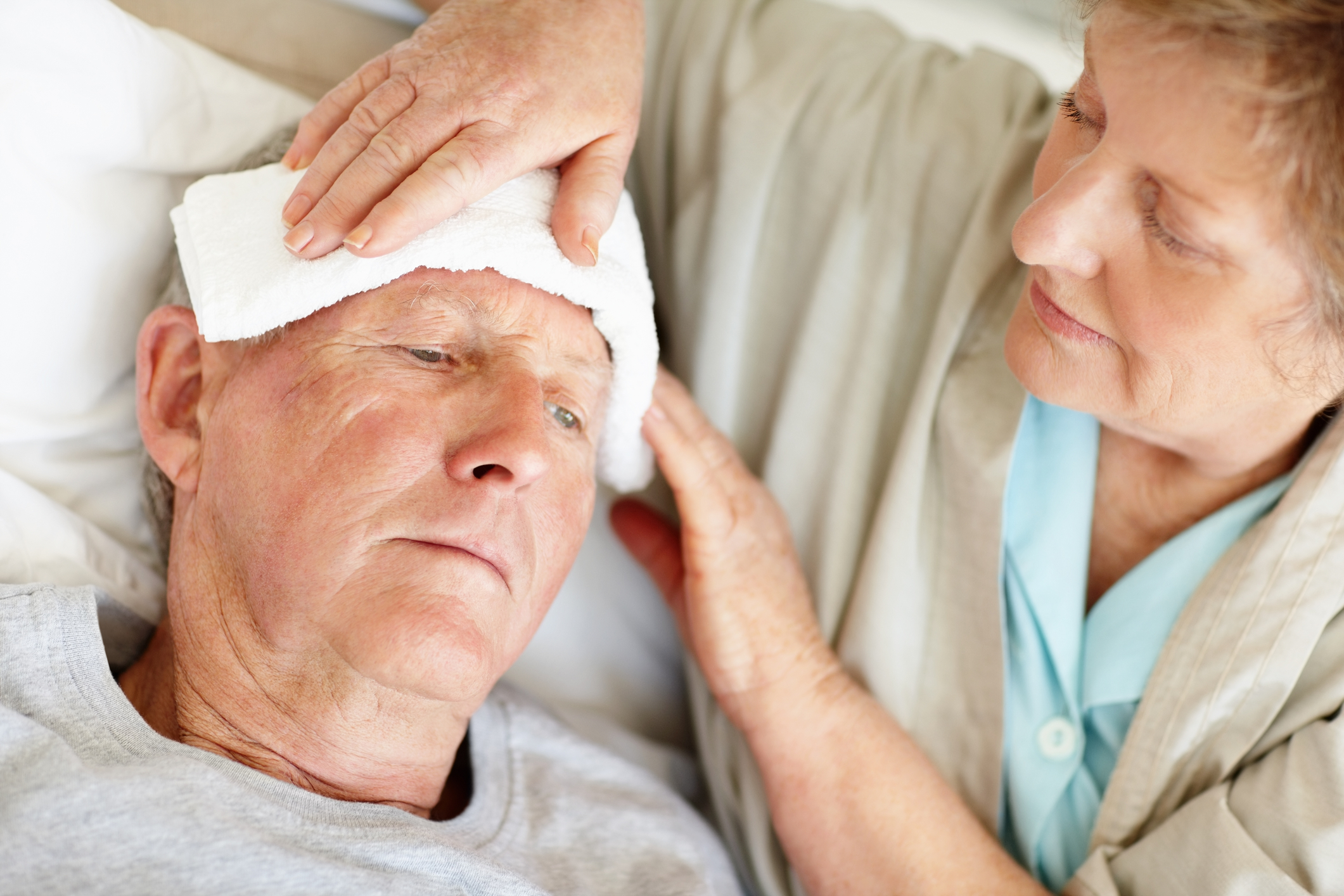 A hospice worker provides comfort measures
