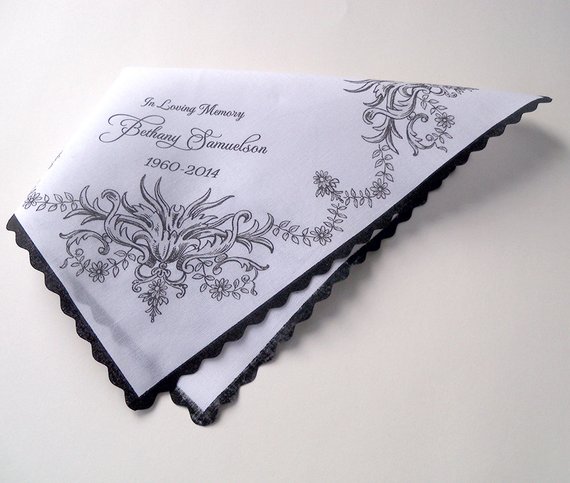 an image of embroidered handkerchiefs in memorium