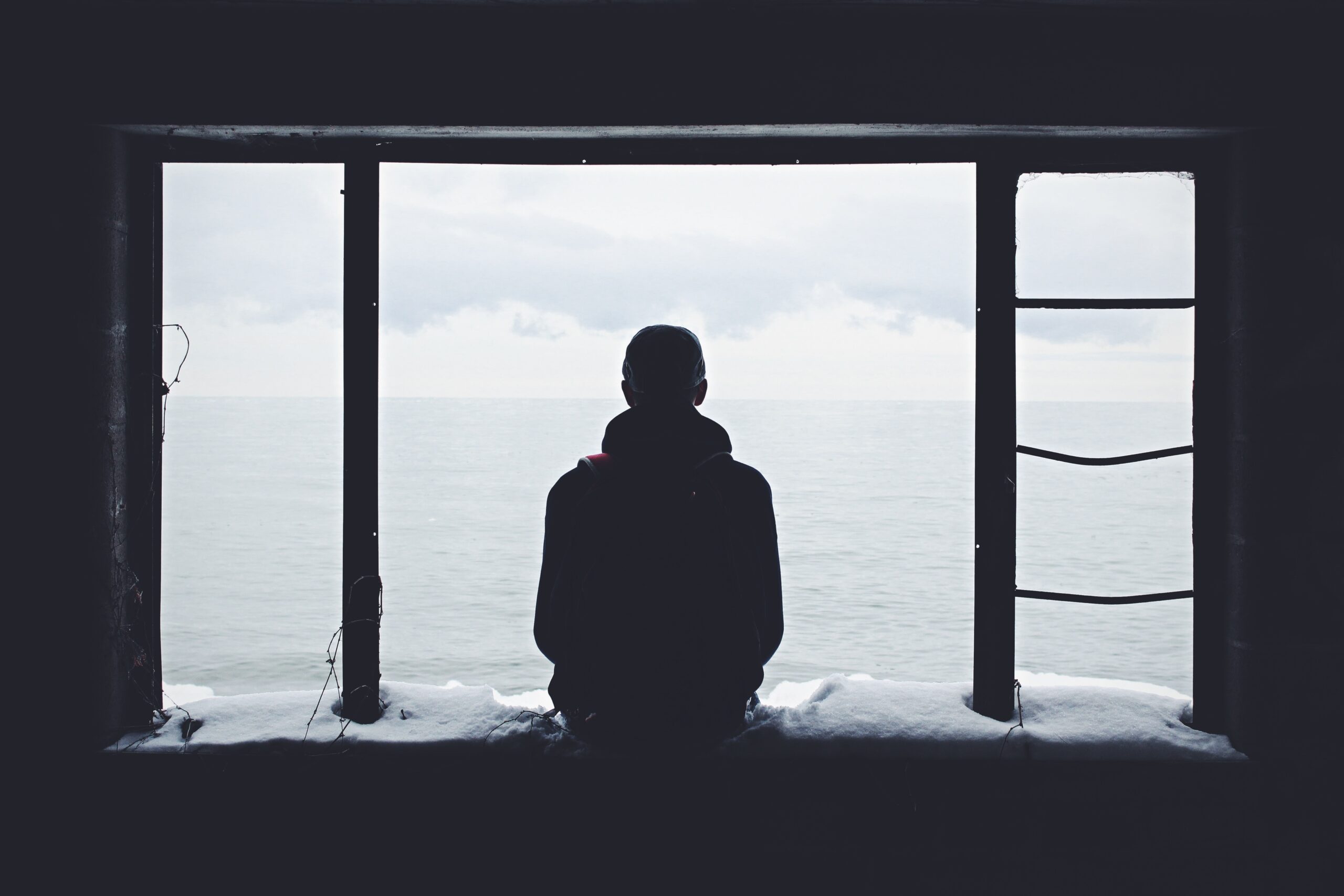 Contemplative Person Staring Out of a Window
