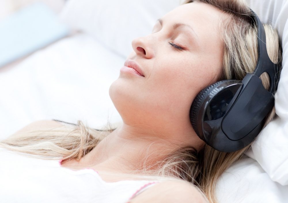 Woman listening to music for self hypnosis