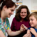 Nurse giving an injection shows healthcare jobs growth
