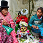 Armayan woman and child sitting next to a natita skull.