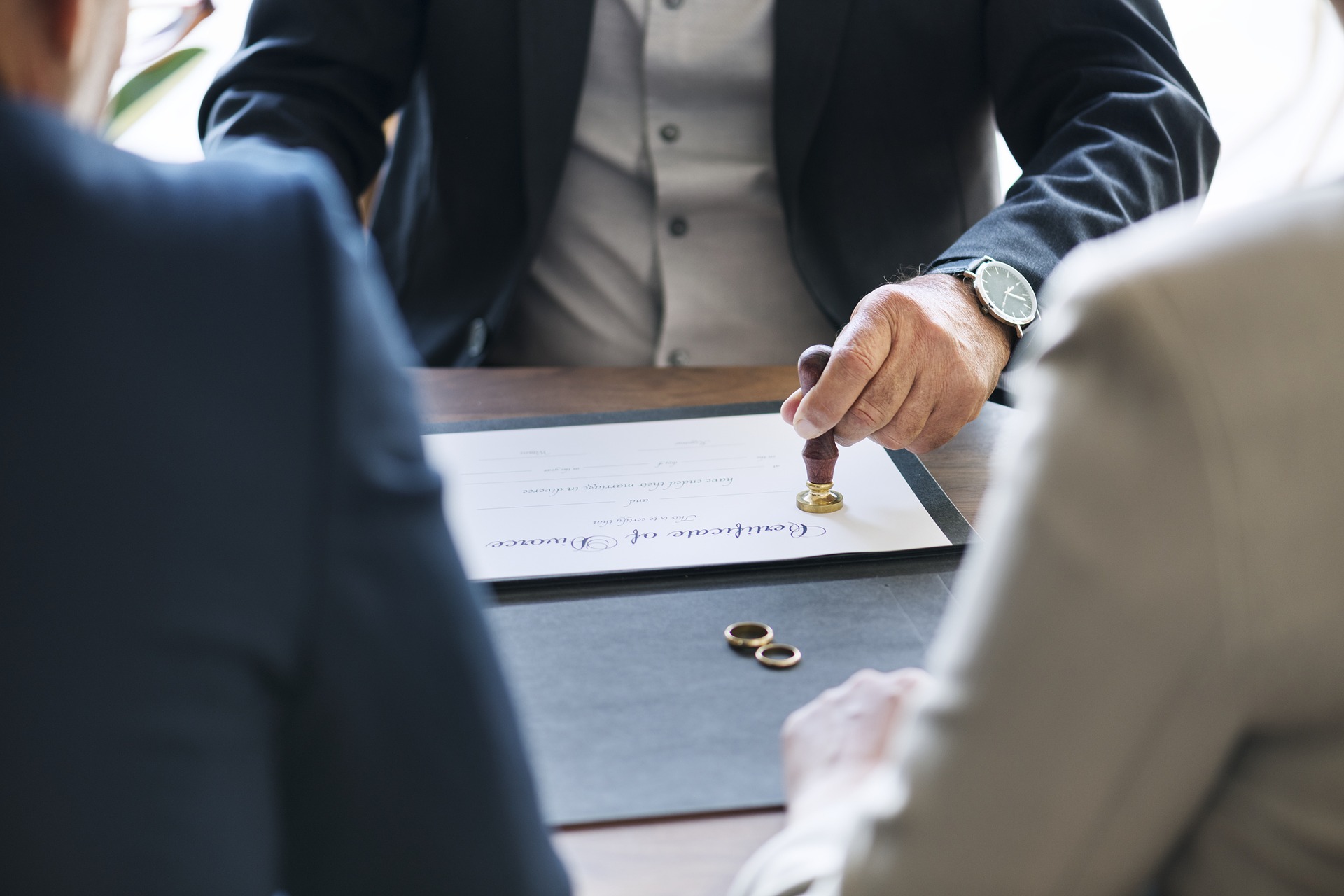 Lawyer stamping a divorce certificate.