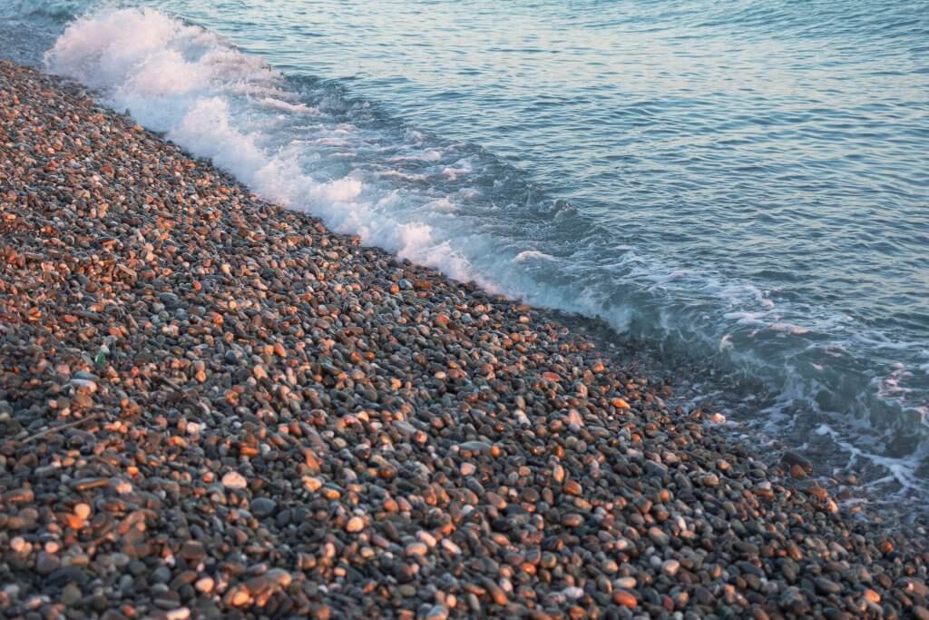 Pebble beach with waves gently washing ashore