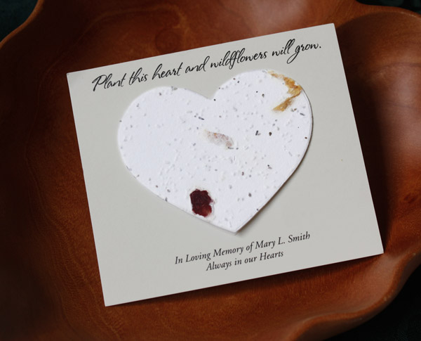 Flower-infused seed card shaped like a heart