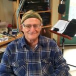 Barry Vogel sitting in his Radio Curious studio.