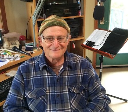 Barry Vogel sitting in his Radio Curious studio.