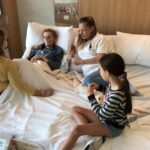Dying woman lies in cuddle bed with her family