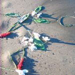 image of flowers and cremation ashes scattered at the beach