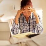 Image of senior women stressed because of COVID-19 scams and fraud