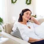 Image of someone listening to a playlist made in memory of someone who has died