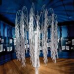 Photograph of white willow tree sculpture in museum - part of exhibit on child loss