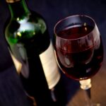 bottle and glass of red wine in palliative care