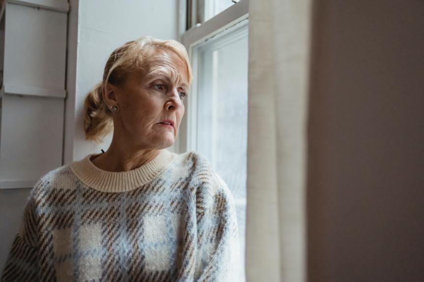 a grieving middle aged woman at risk of heart disease