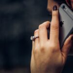woman on phone with funeral scam
