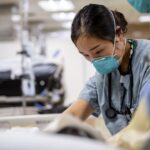 nurse caring for hiv patient with stem cell transplant