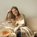 Susanne Duijvestein seated on couch