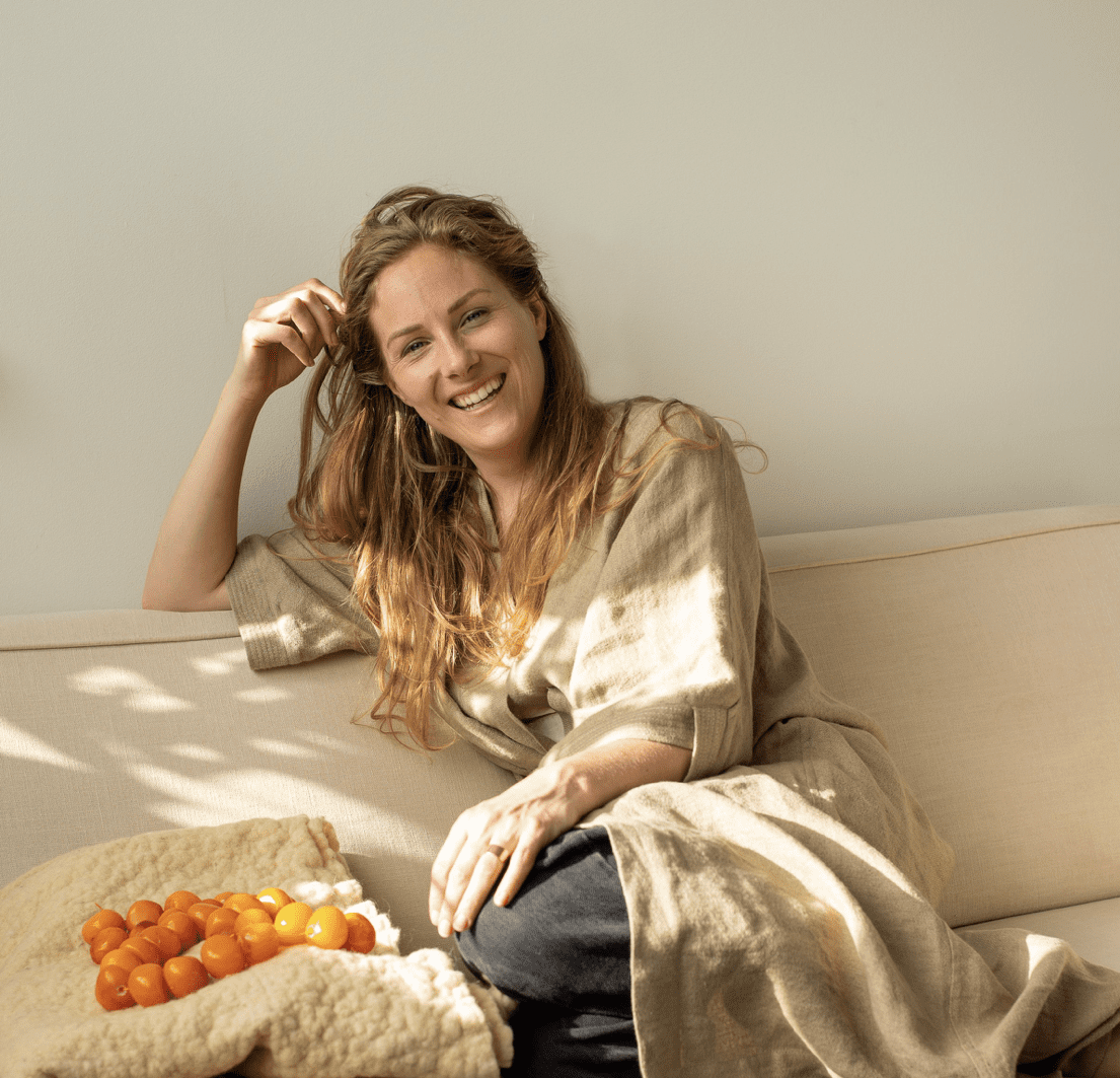 Susanne Duijvestein seated on couch