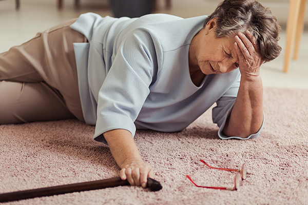 senior woman on floor after falling