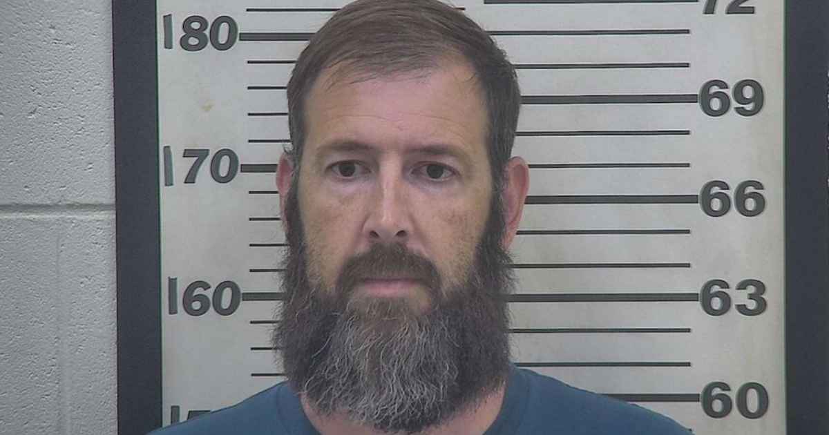 Booking photo of funeral home owner Chris Johnson.
