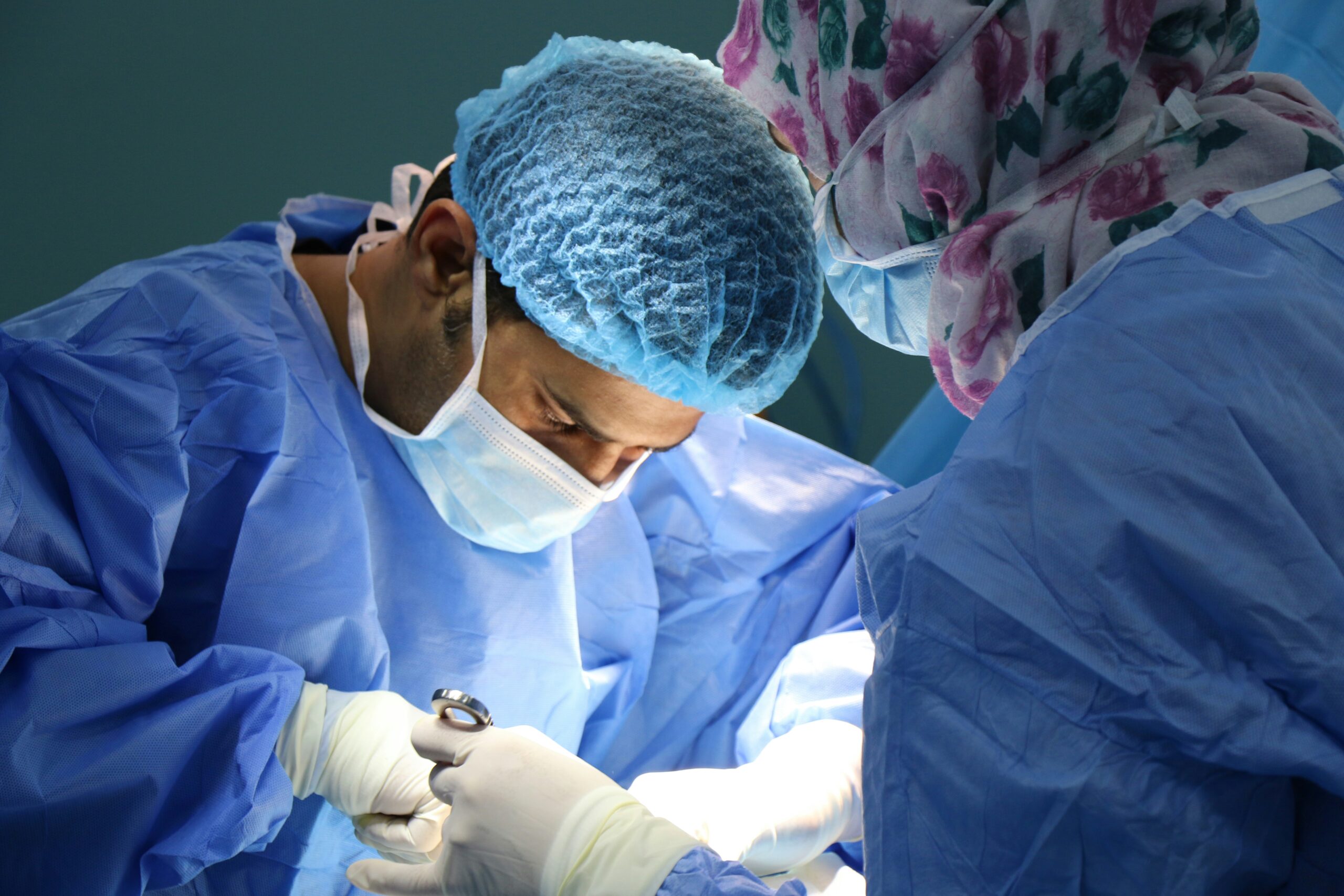 A doctor performs surgery.
