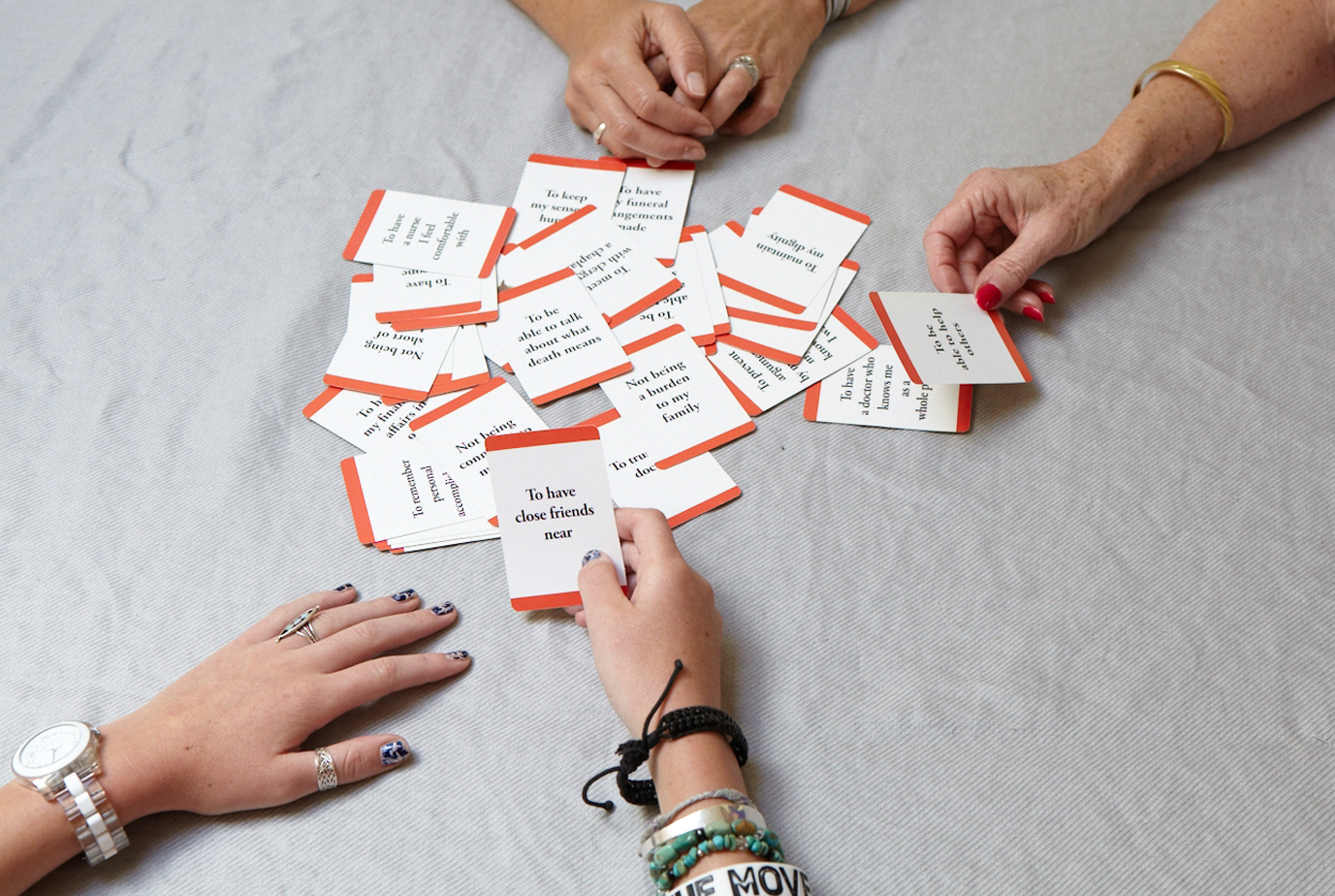 A family playing an end-of-life game to easily figure out wishes for an advance directive
