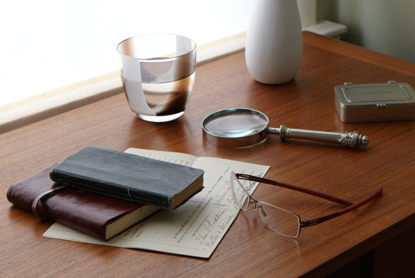 journals and glasses sit on a table from an attorney planning an estate