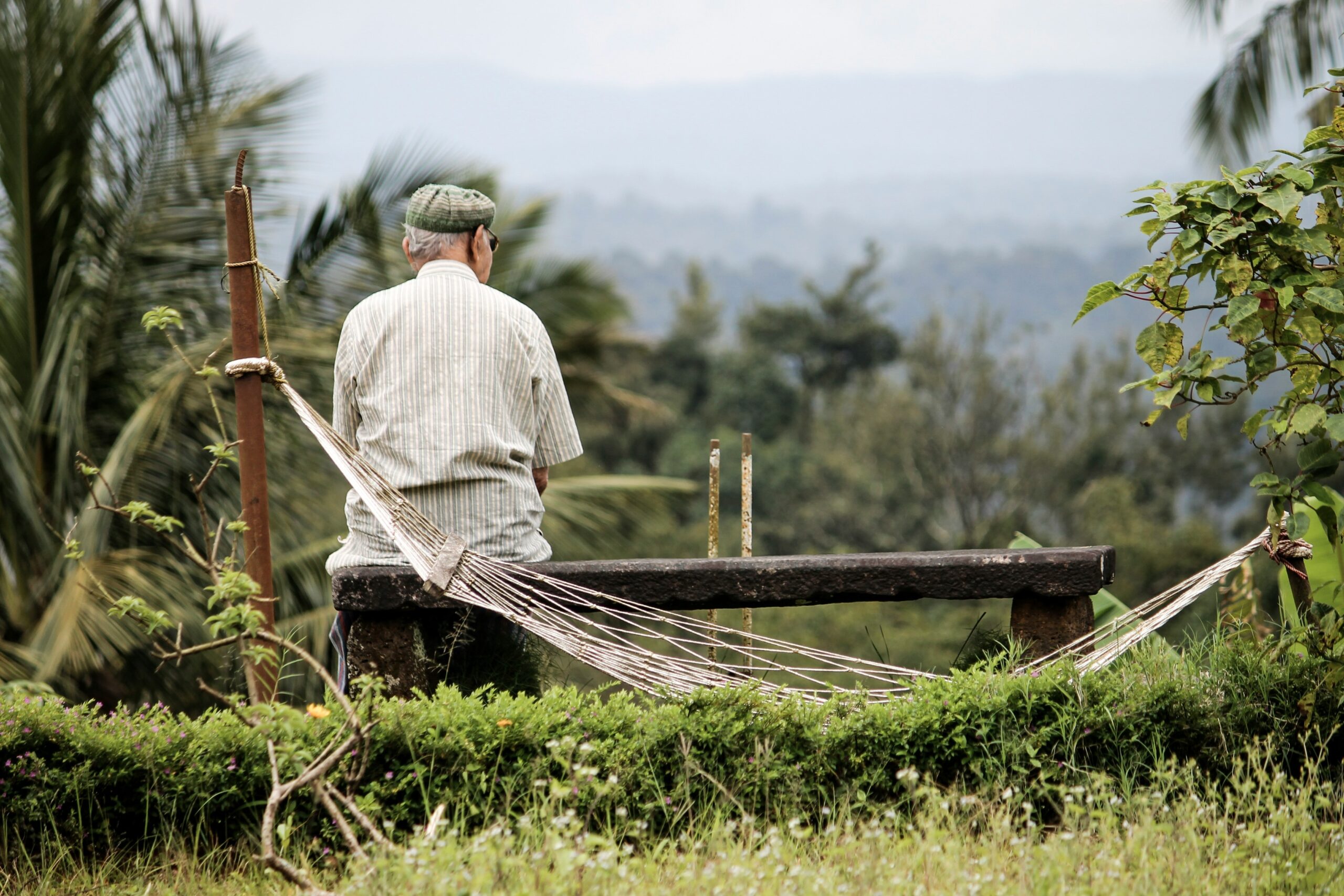 an older man is looking into the horizon contemplating end of life