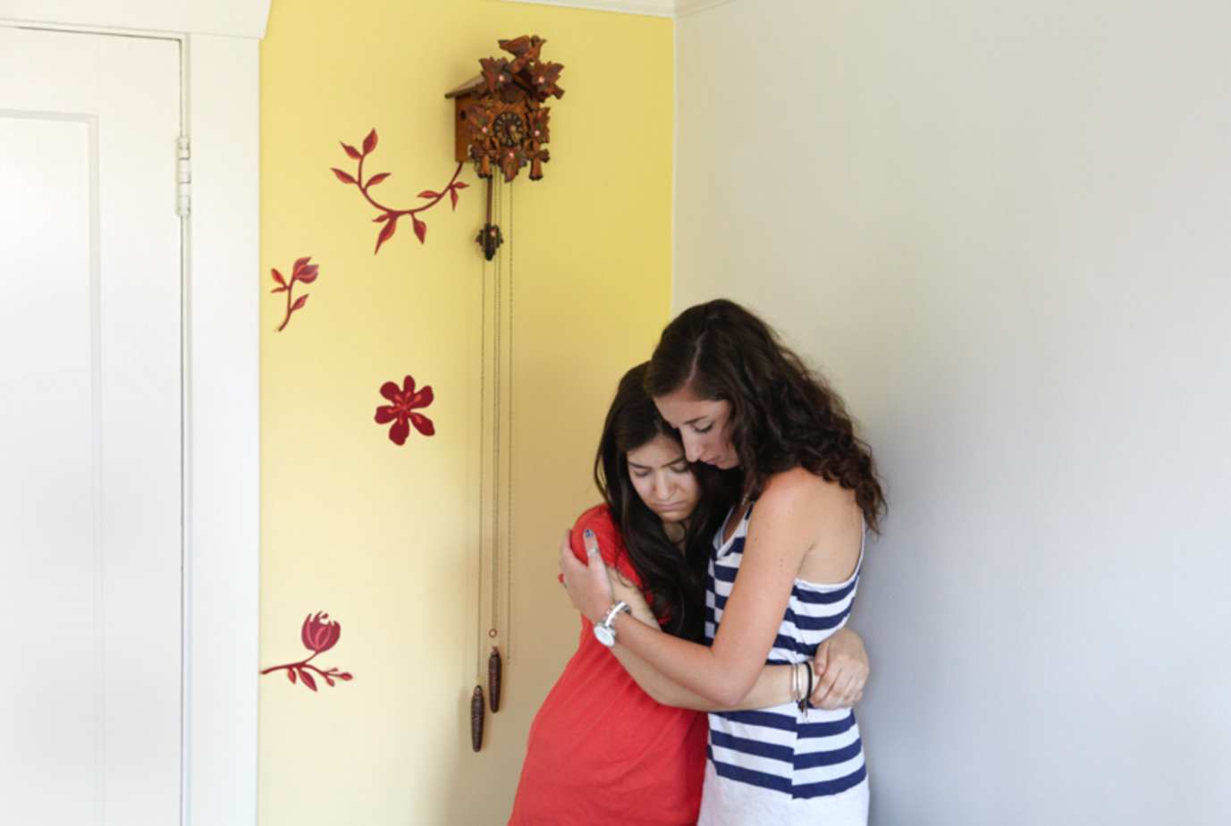 Two young women hugging each other experiencing grief and loss