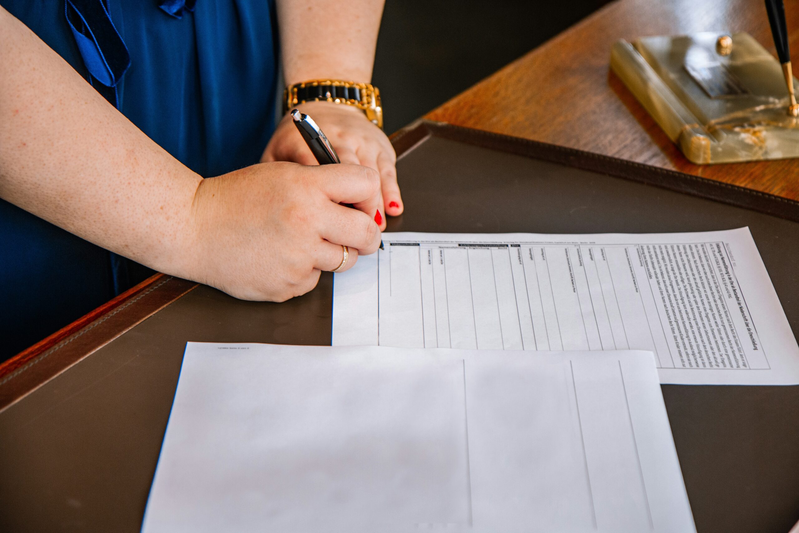 a woman signing papers showing DNR formats