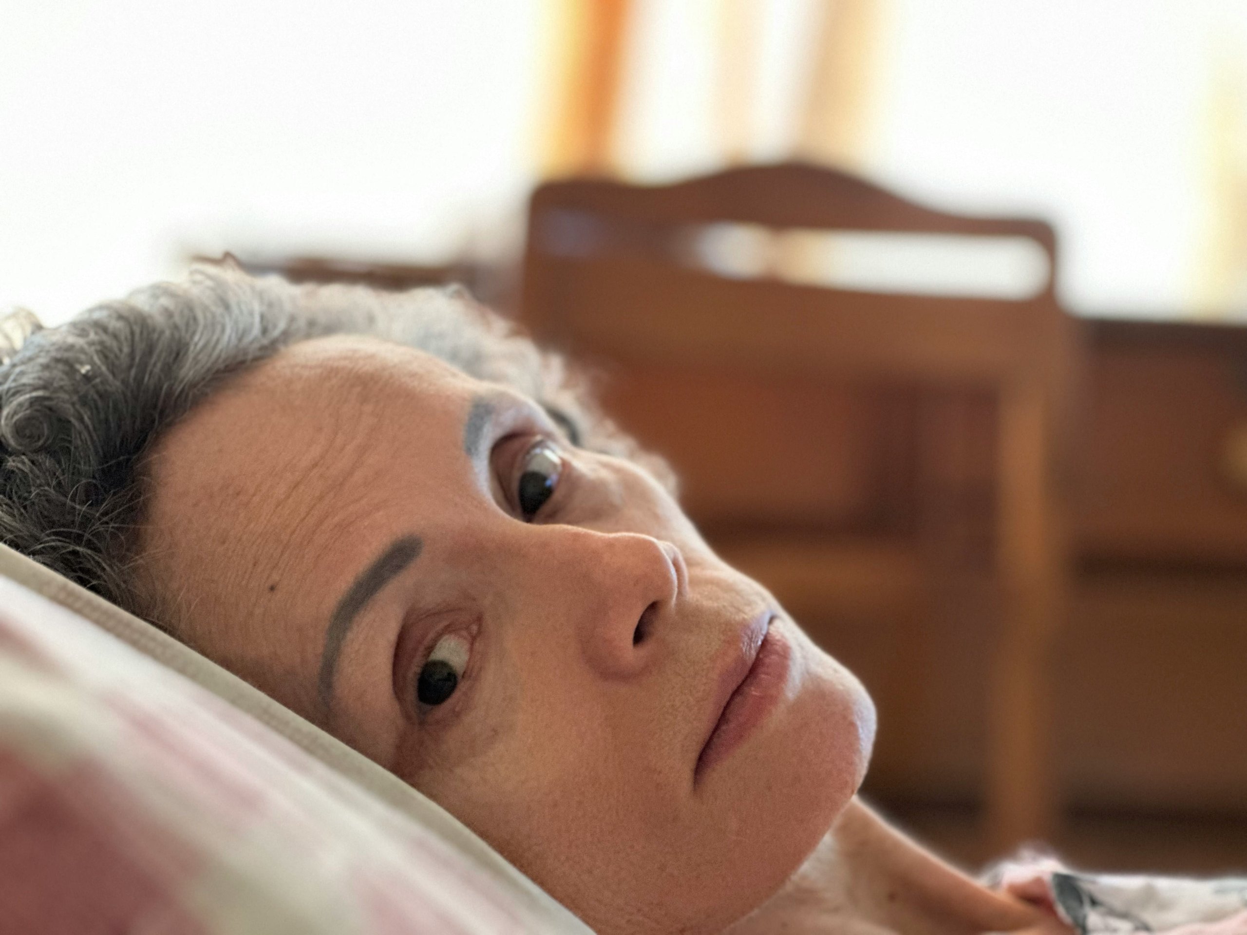 Woman in bed who chose to die by voluntarily stopping eating and drinking