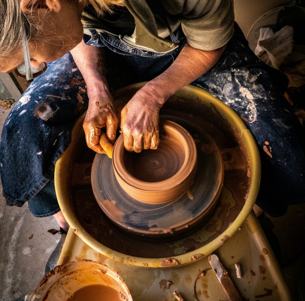 man throwing a pot to heal from the loss of his wife
