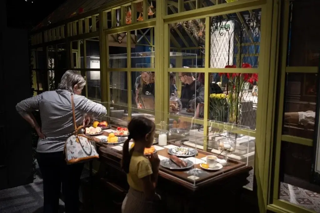 Family looking into a case of toxic foods at the exhibition death by natural causes