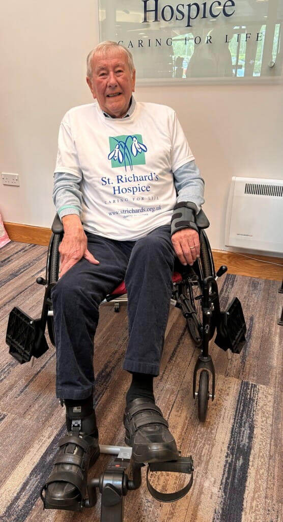 Man riding stationary bicycle to raise money for hospice