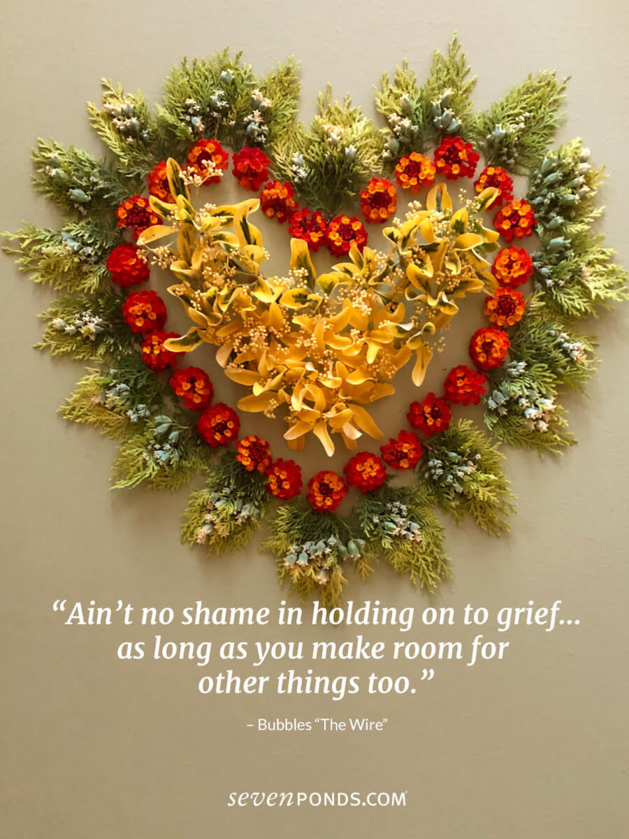 A fall flower heart with a quote about about no shame in grief