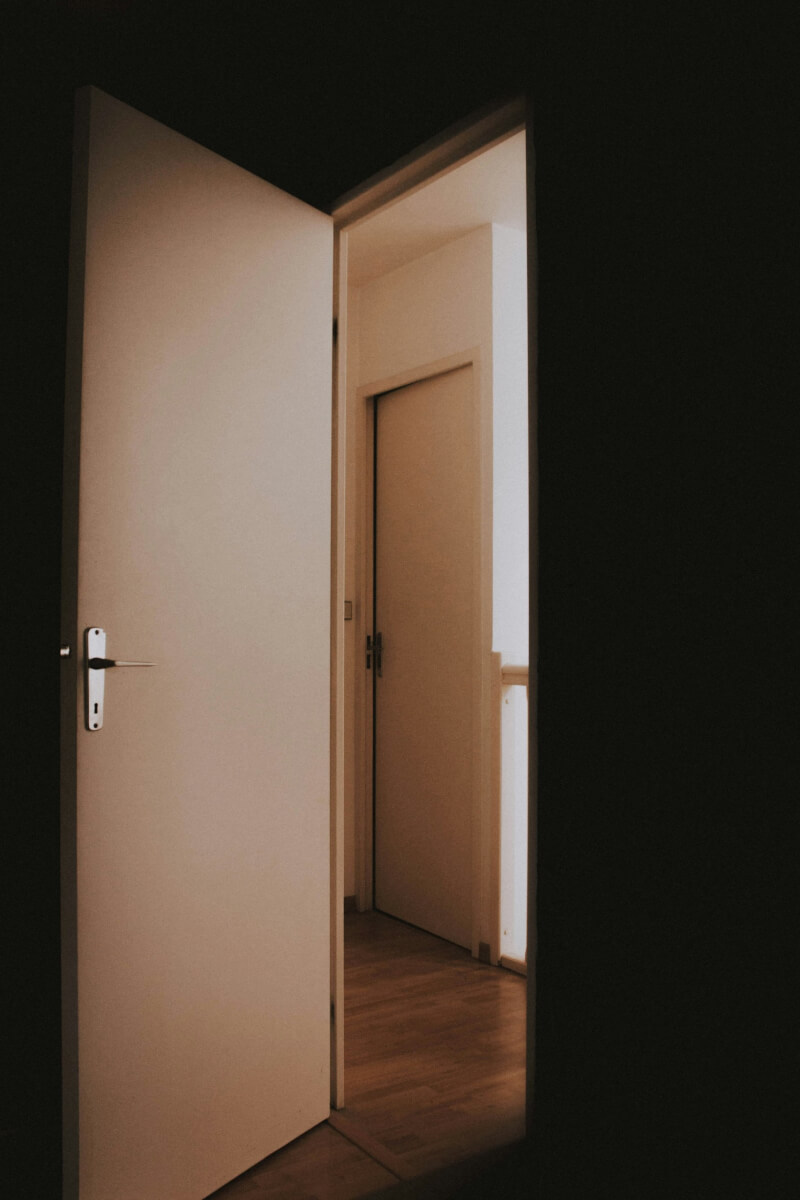 door opening in the dark illustrating quotes about a person's final exit